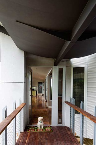 The townhouse is accessed via a bridge across the courtyard, intensifying the sense of intrigue as one approaches from the street.